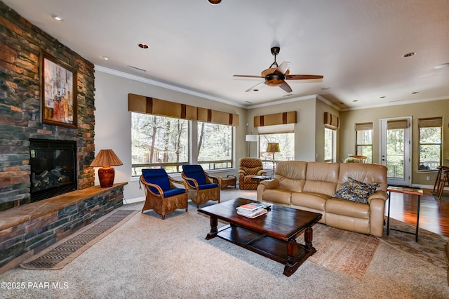 1021 Sheriffs Posse Trl, Prescott, AZ 86303 - living room featuring plenty of natural light, ceiling fan, a fireplace, ornamental molding, and carpet