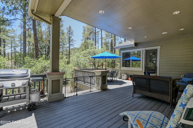 1021 Sheriffs Posse Trl, Prescott, AZ 86303 - wooden deck with outdoor dining area, an outdoor living space, and area for grilling