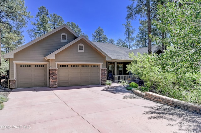 1021 Sheriffs Posse Trl, Prescott, AZ 86303 - craftsman inspired home featuring a garage, driveway, and stone siding