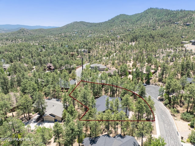 1021 Sheriffs Posse Trl, Prescott, AZ 86303 - aerial overview of property's location featuring a mountainous background and property parcel outlined