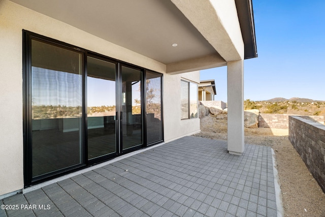 view of patio with a mountain view