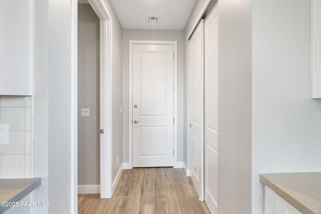 hall featuring light hardwood / wood-style flooring