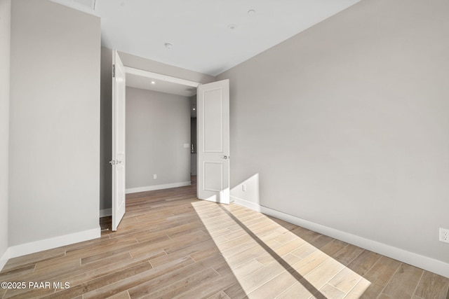 unfurnished room featuring light hardwood / wood-style flooring