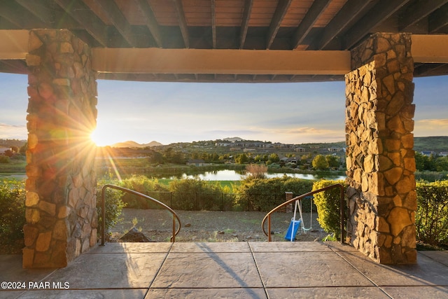 patio terrace at dusk with a water view