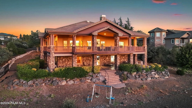 view of front of home featuring a balcony