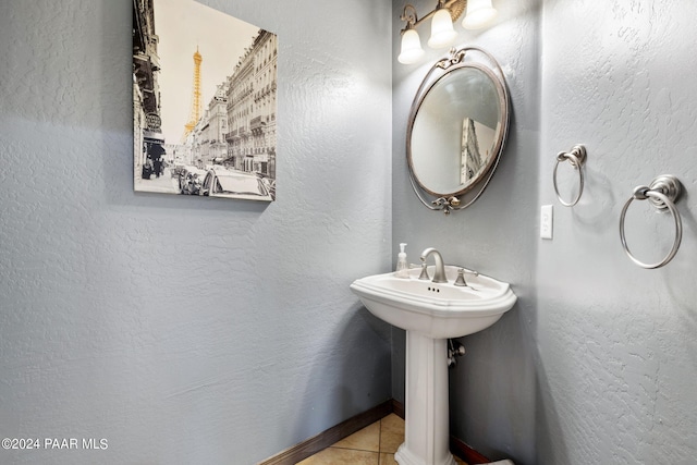 bathroom with tile patterned floors and sink