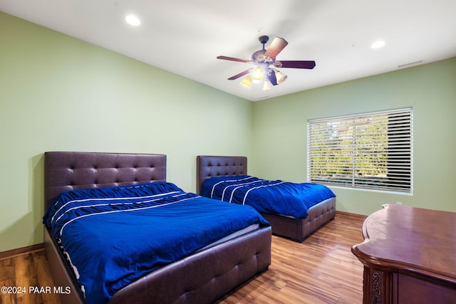 bedroom featuring ceiling fan and wood-type flooring