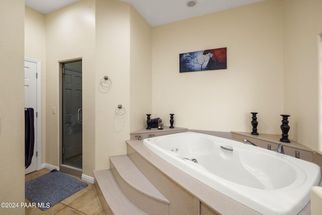 bathroom with tile patterned floors and separate shower and tub