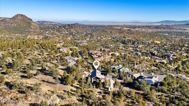 birds eye view of property with a mountain view