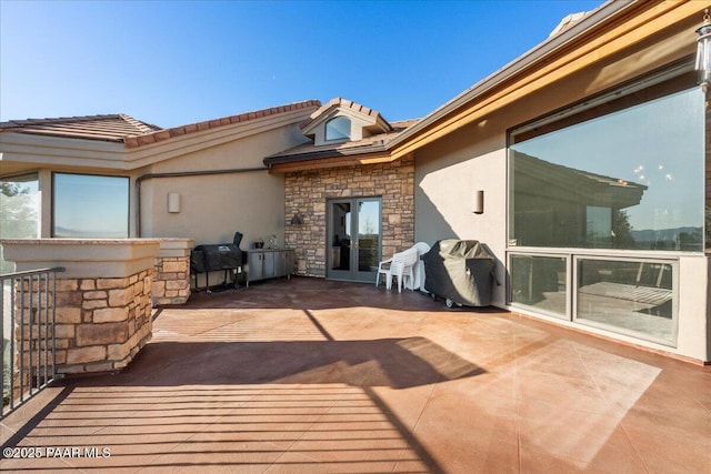 view of patio with a grill