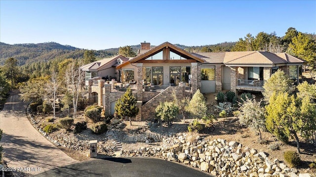 view of front of home featuring a mountain view