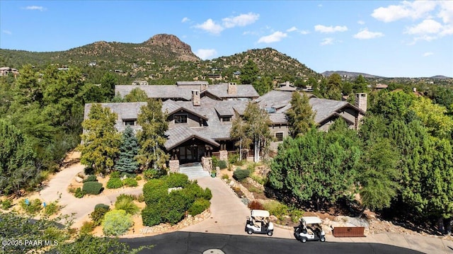 birds eye view of property featuring a mountain view