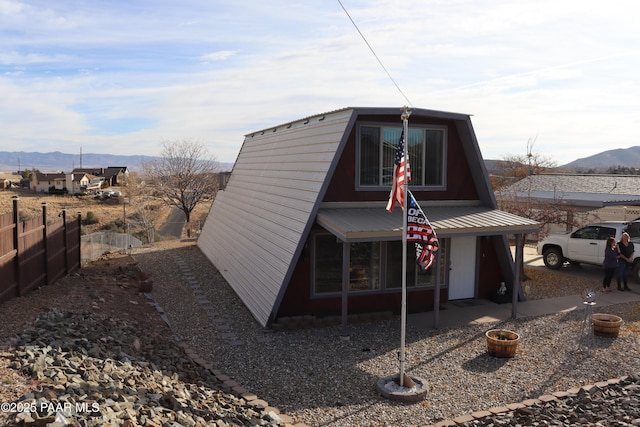 view of outbuilding featuring a mountain view