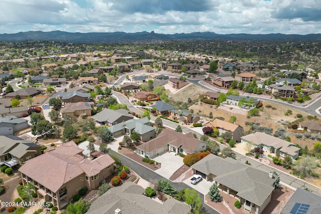 birds eye view of property with a mountain view