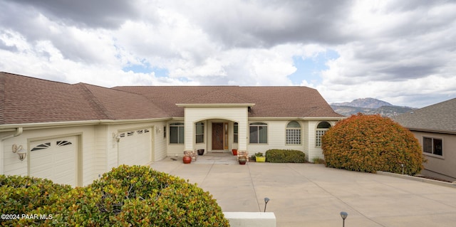 view of front of house with a mountain view and a garage