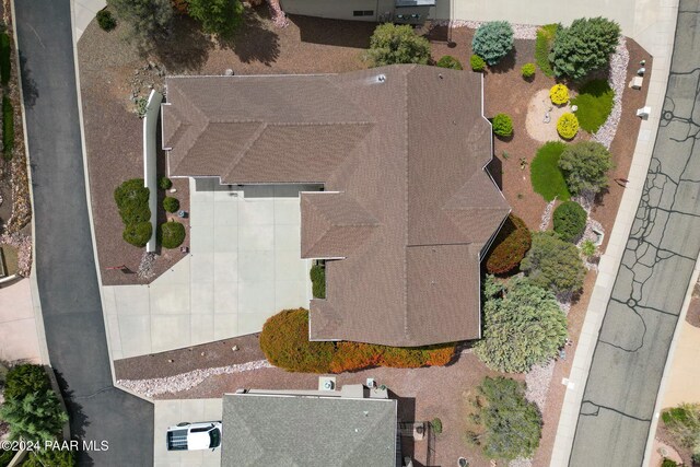 rear view of property featuring a mountain view and a balcony