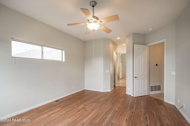 unfurnished room featuring hardwood / wood-style flooring and ceiling fan