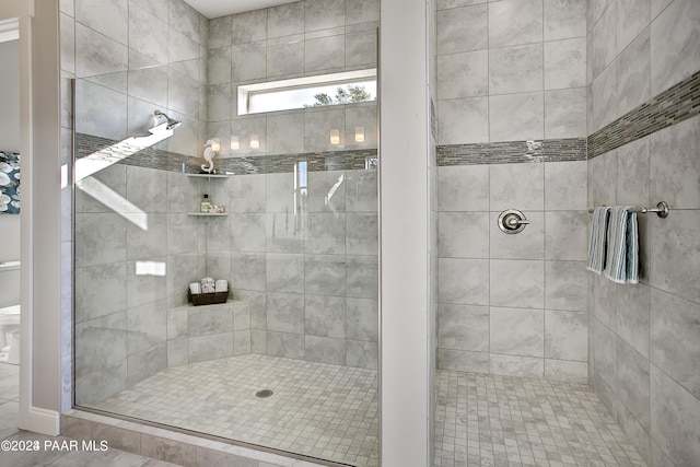 bathroom with a tile shower