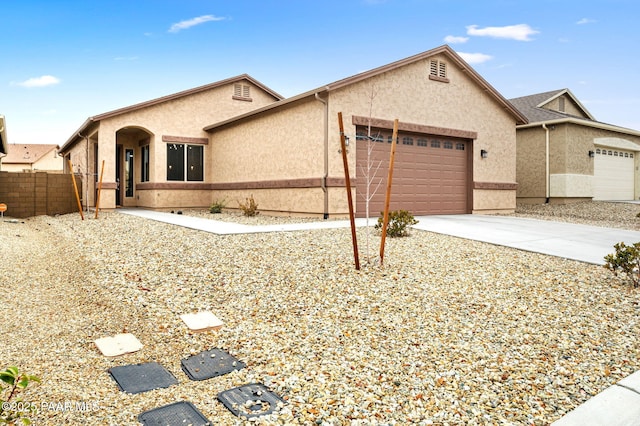 ranch-style home with a garage