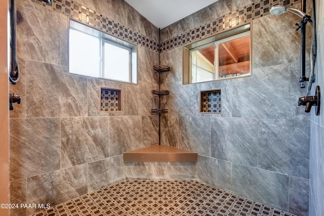 bathroom featuring tiled shower