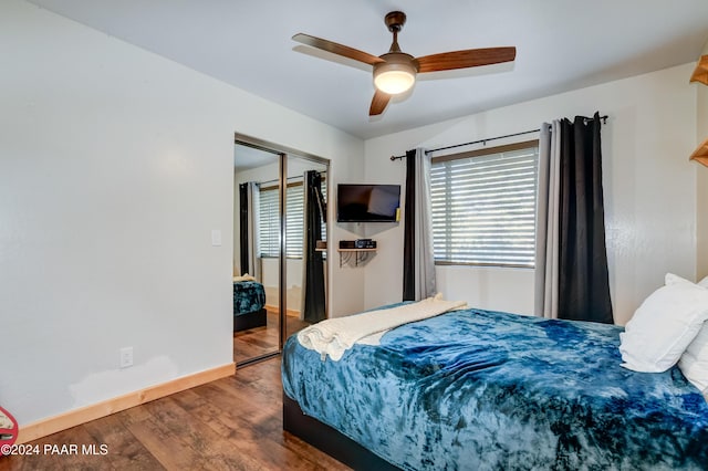 bedroom with hardwood / wood-style floors, a closet, and ceiling fan