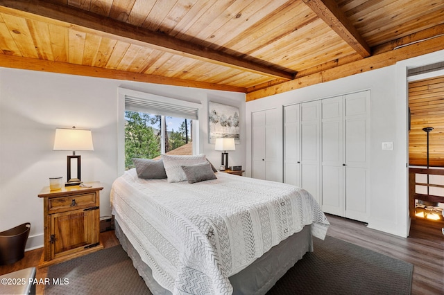 6231 S Champion Way Rd, Prescott, AZ 86303 - bedroom featuring a wooden ceiling with exposed beams, dark wood finished floors, and two closets