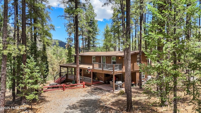 6231 S Champion Way Rd, Prescott, AZ 86303 - rear view of house featuring a deck, a view of trees, and a shingled roof