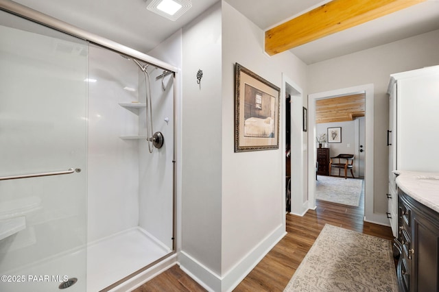 6231 S Champion Way Rd, Prescott, AZ 86303 - bathroom with a stall shower, vanity, wood finished floors, and beam ceiling