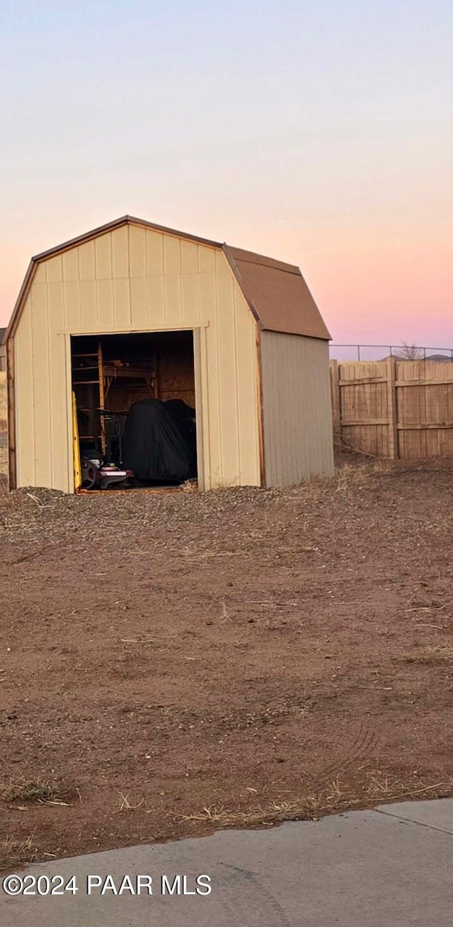 view of outdoor structure at dusk