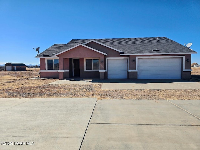 ranch-style home with a garage