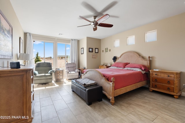 bedroom with access to exterior, light wood-style flooring, visible vents, and a ceiling fan