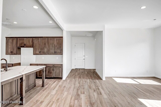 gym featuring a drop ceiling, hardwood / wood-style floors, and plenty of natural light