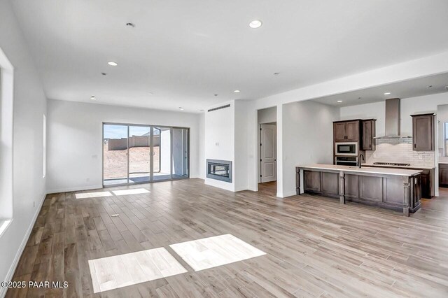 gym featuring a paneled ceiling and hardwood / wood-style floors