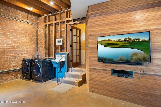 1614 SW Palmcroft Dr, Phoenix, AZ 85007 - interior space with wood walls, brick wall, and washer and dryer