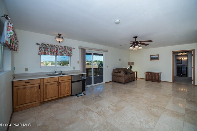 kitchen with ceiling fan and sink