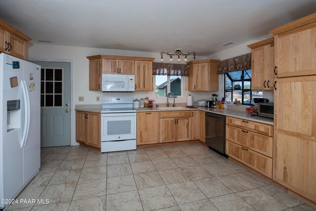 kitchen with sink and appliances with stainless steel finishes