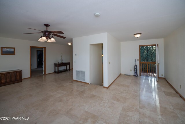 unfurnished room with ceiling fan