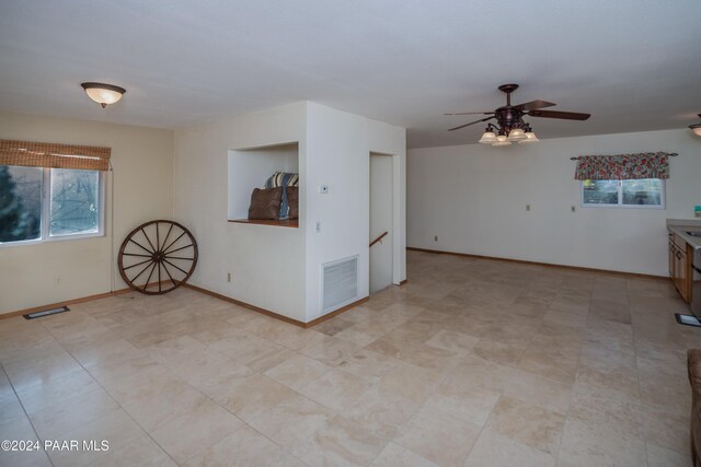 unfurnished room with ceiling fan