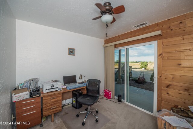 home office with ceiling fan and light colored carpet