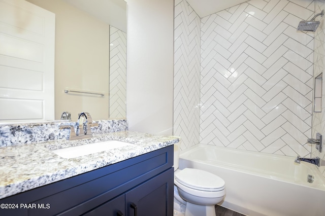 full bathroom with vanity, tiled shower / bath combo, and toilet