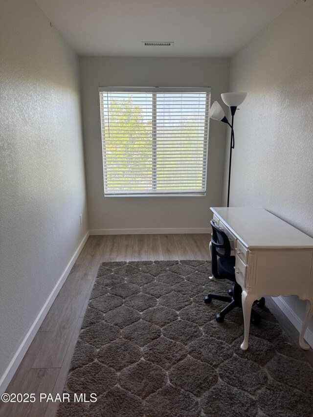 3070 Smokey Rd Unit 17E, Prescott, AZ 86301 - office area with wood finished floors, baseboards, and a textured wall
