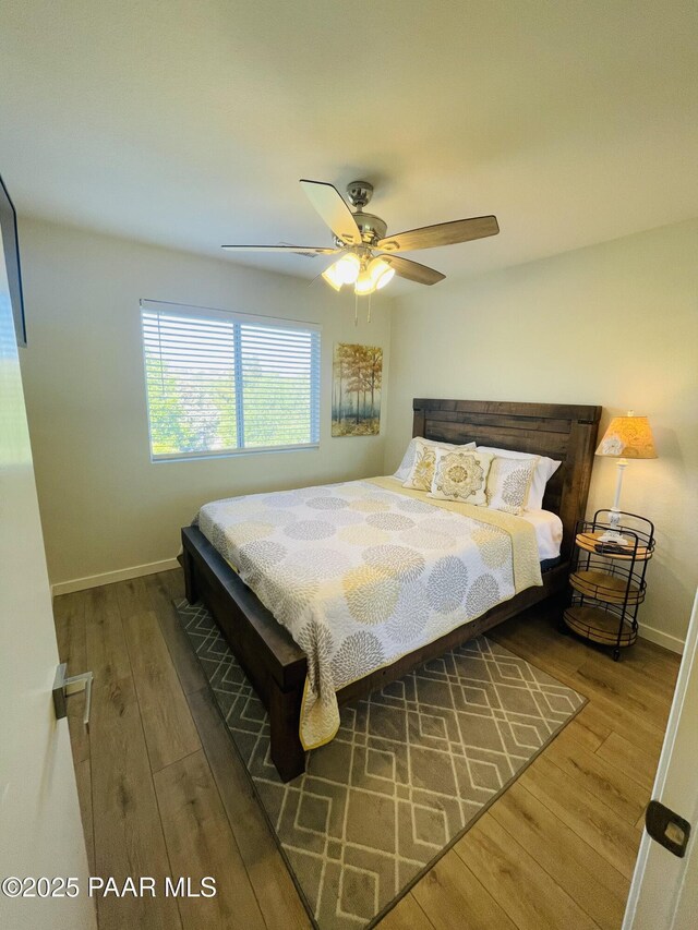3070 Smokey Rd Unit 17E, Prescott, AZ 86301 - bedroom featuring wood finished floors, baseboards, and ceiling fan