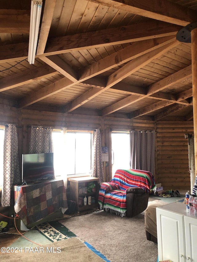 living room featuring carpet floors, a healthy amount of sunlight, and wood ceiling