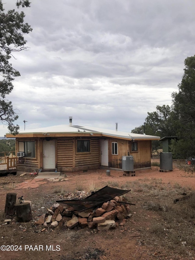 back of property with a wooden deck