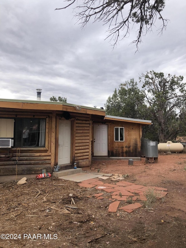 view of front of house featuring cooling unit