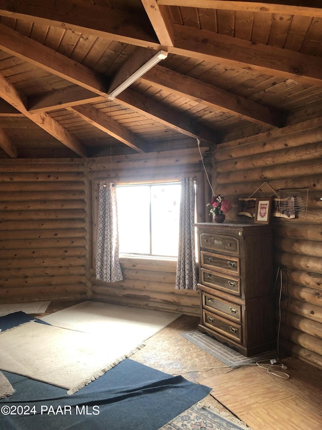 unfurnished bedroom featuring beam ceiling, rustic walls, wood ceiling, and hardwood / wood-style flooring