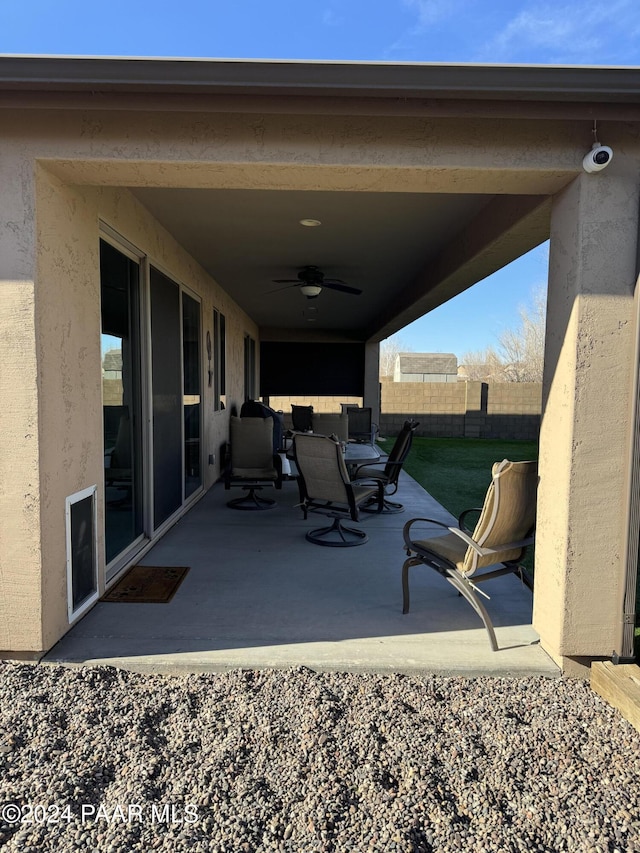 view of patio / terrace featuring ceiling fan