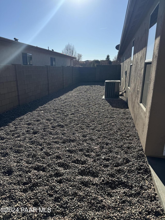 view of yard featuring central AC unit