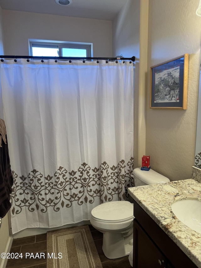 bathroom with vanity and toilet