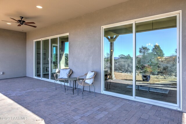 view of patio featuring a ceiling fan